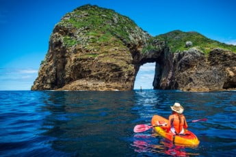 Poor Knights Islands paddleboarder and kayaker, New Zealand. 