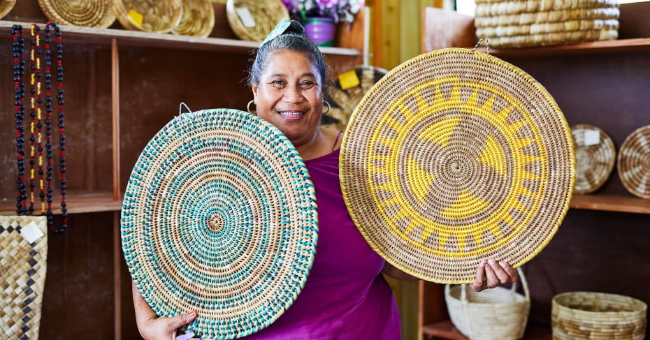Woman with her weavings, Niue. 